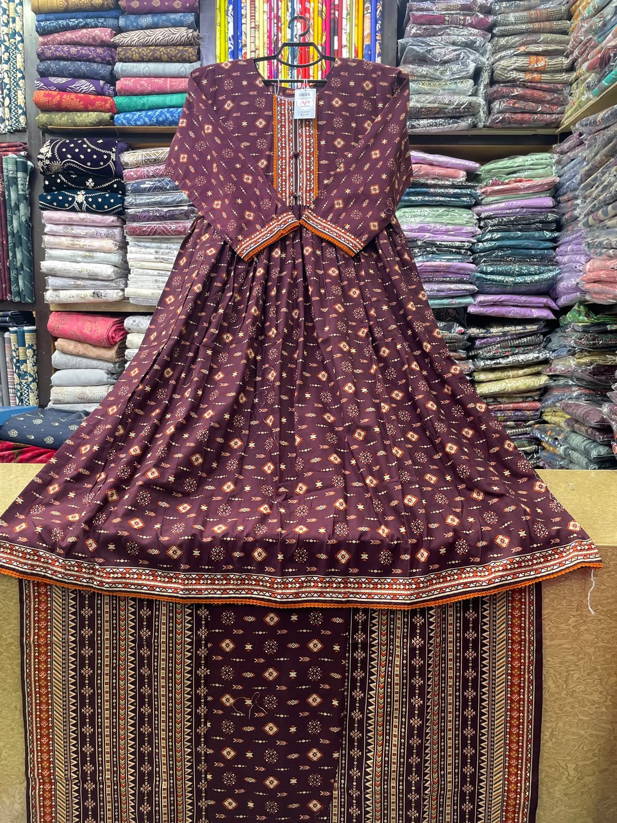 Bin Saeed 3-Piece Stitched Khaddar Suit | Deep Plum & Rust Geometric Printed Flared Frock Set