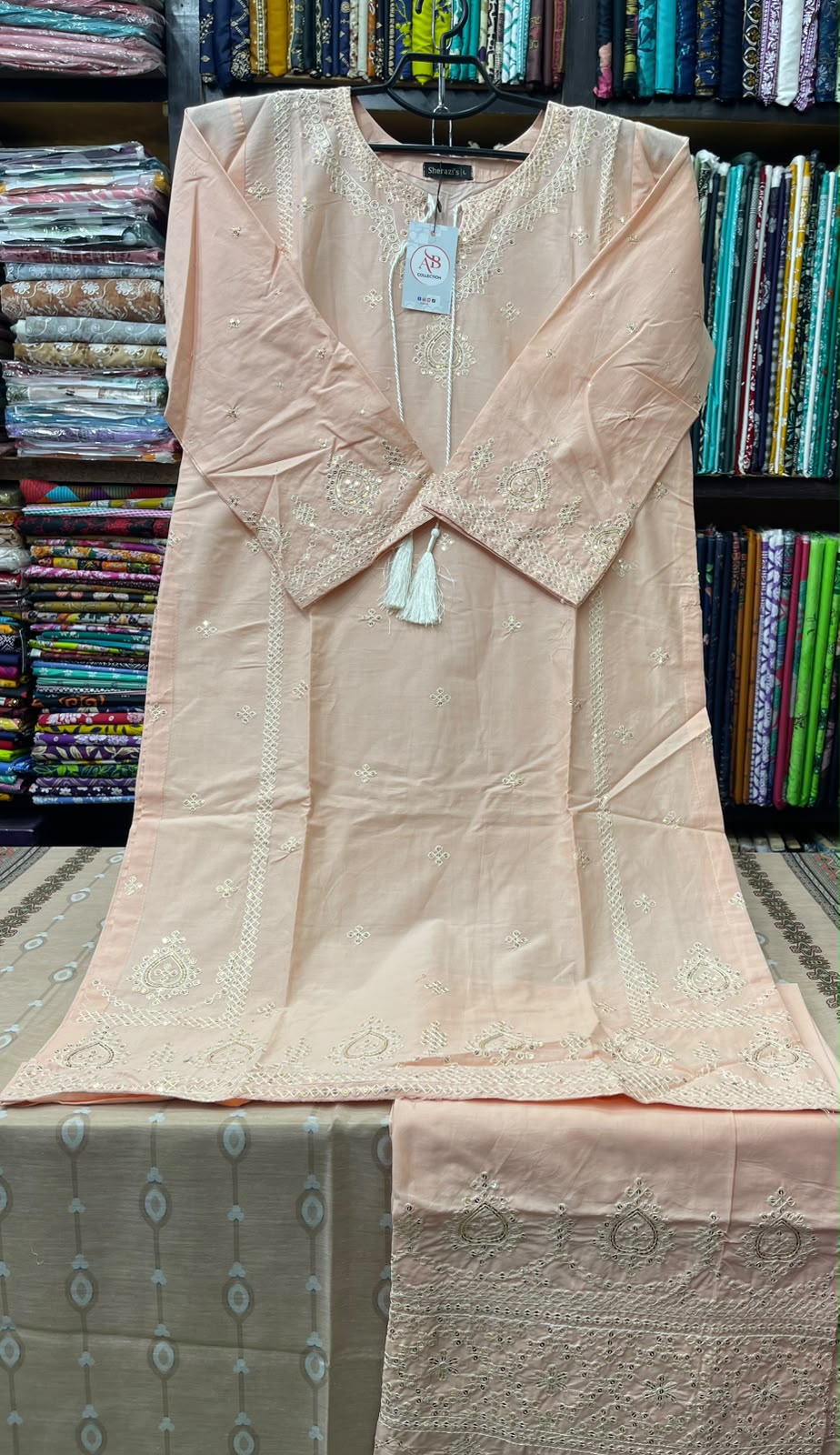 Premium Stitched 3-Piece Peach Lawn Suit with Tonal Embroidery and Tassel Details