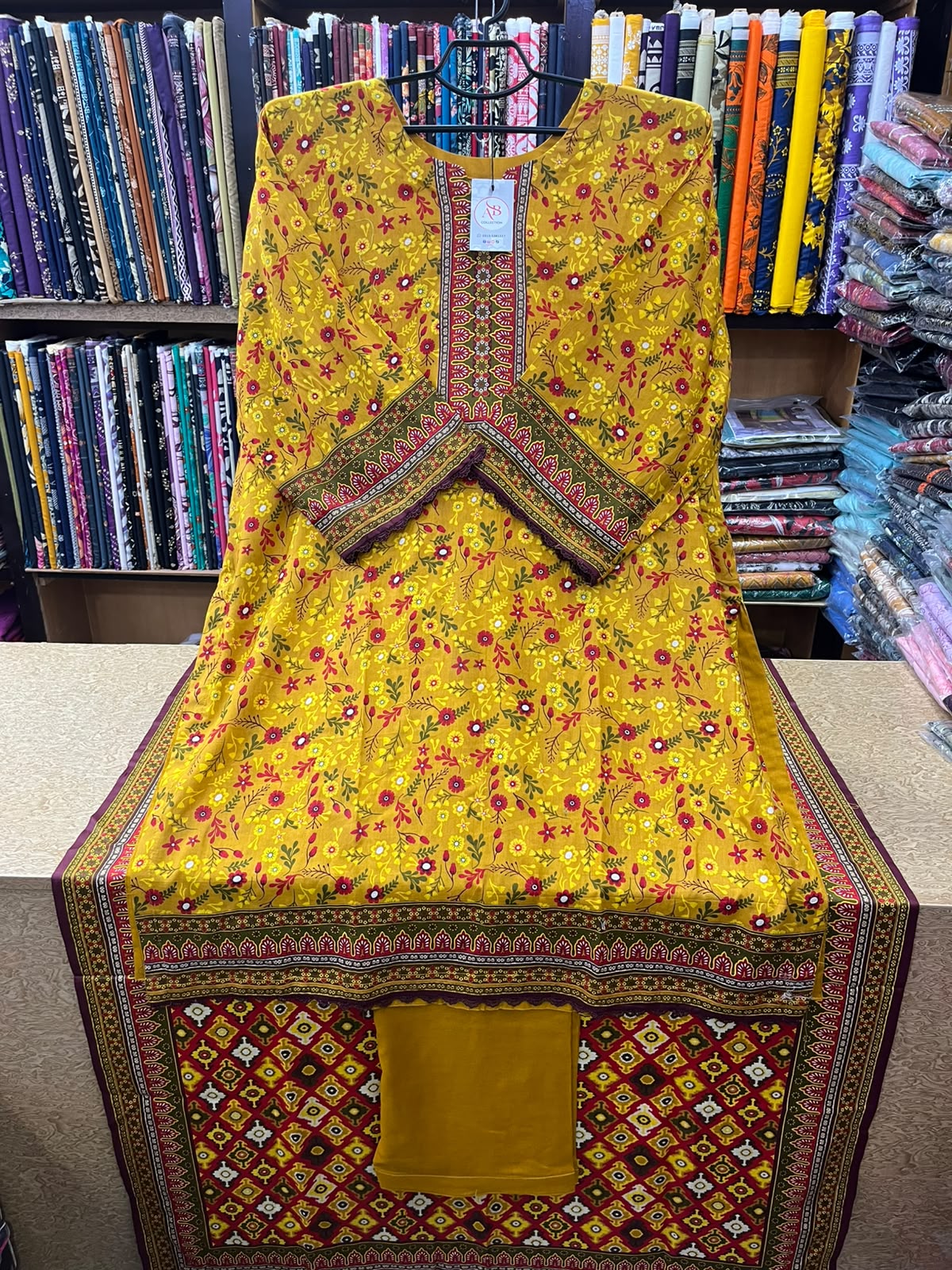 Mustard Yellow & Red Floral Printed 3-Piece Lawn Suit with Geometric Dupatta & Matching Trouser