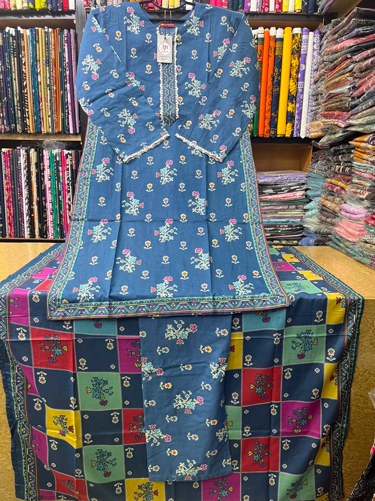 Medium Blue Floral Printed Lawn 3-Piece Suit Vibrant Geometric Grid Lawn Dupatta