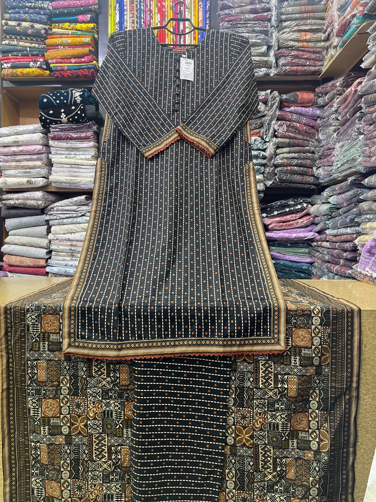 Bin Saeed Charcoal Black Pocket Style Long Length 3-Piece Printed Suit (50" Shirt Length) with Ajrak Pattern Dupatta & Matching Trouser