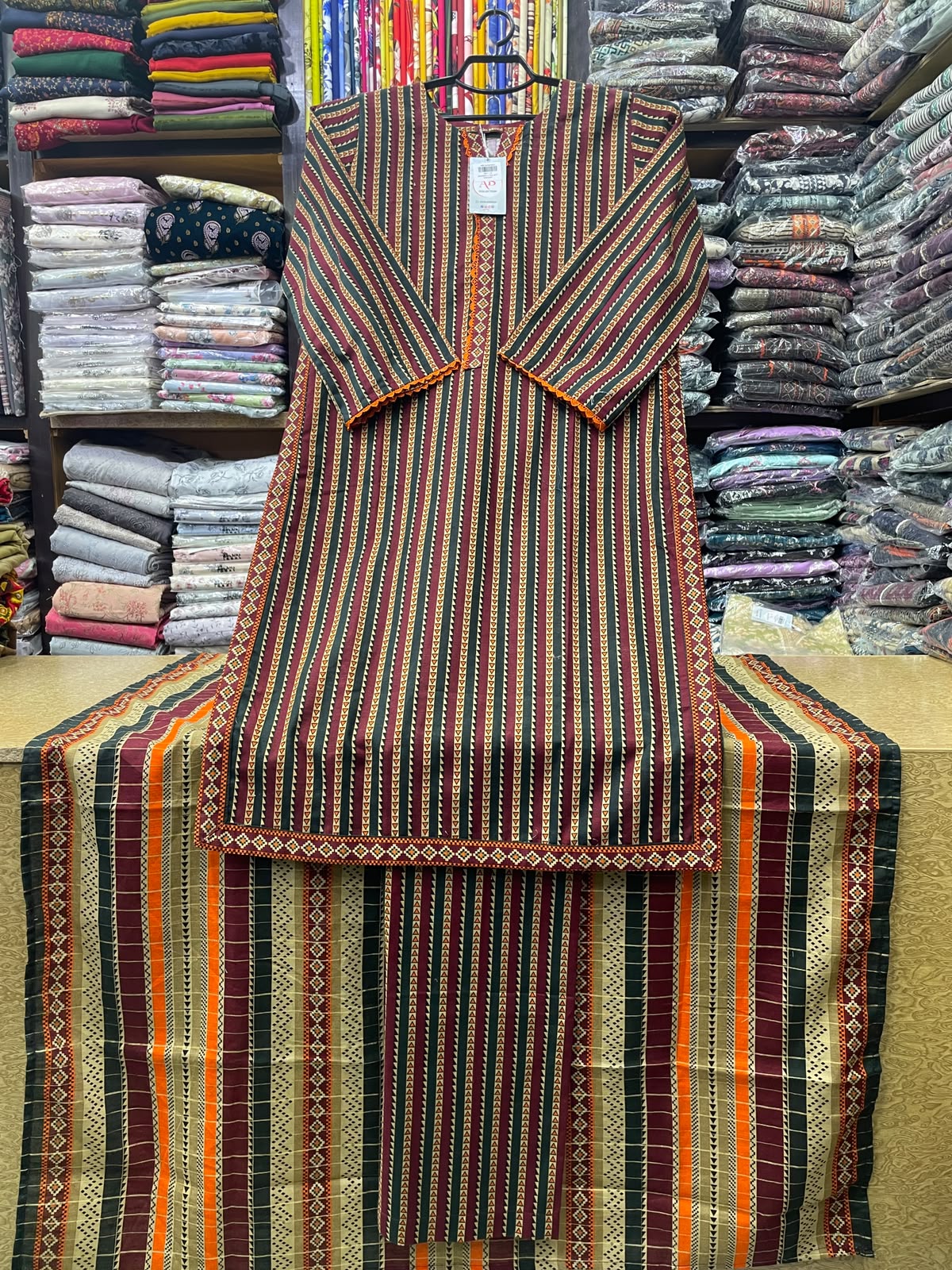 BinSaeed Ready to Wear Stitched Khaddar 3 Piece Suit – Maroon & Orange Multi-Striped Kurta, Trouser & Dupatta