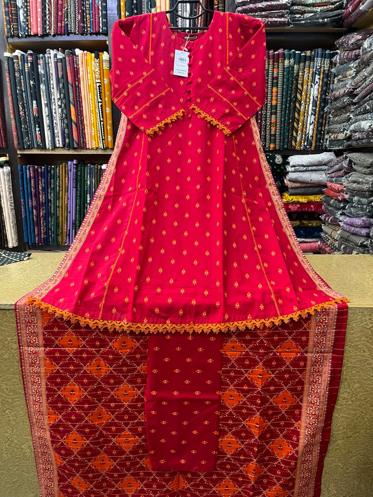 Bin Saeed Winter Khaddar 3-Piece Printed A-Line Frock Suit with Geometric Printed Shawl – Bright Red & Orange